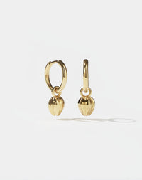Pair of gold tulip bud charm earrings with on a white background