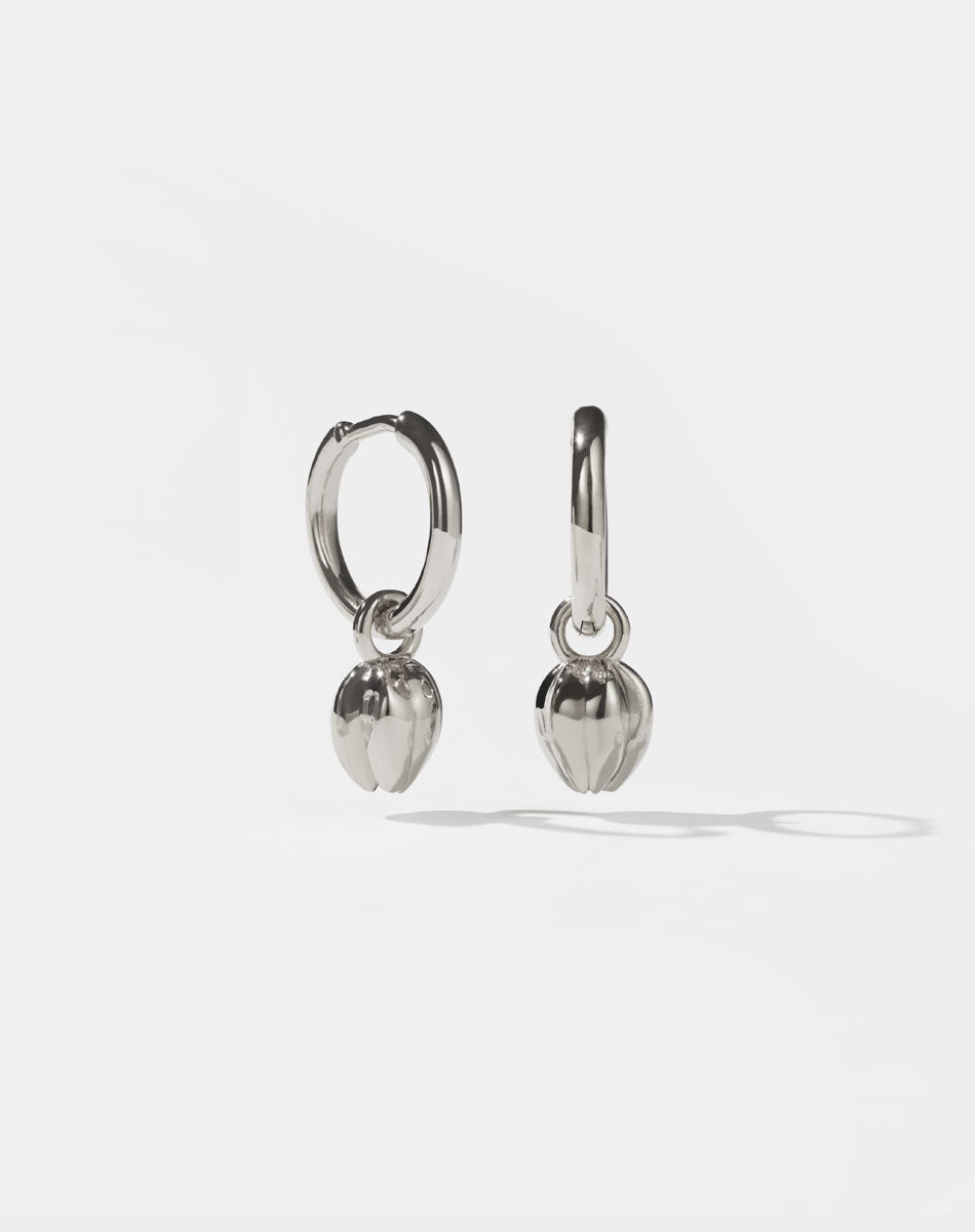 Pair of silver Tulip bud  charm earrings on a white background