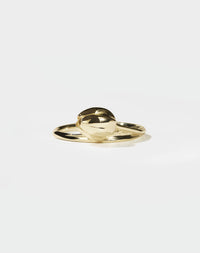 Gold tulip motif ring on a white background
