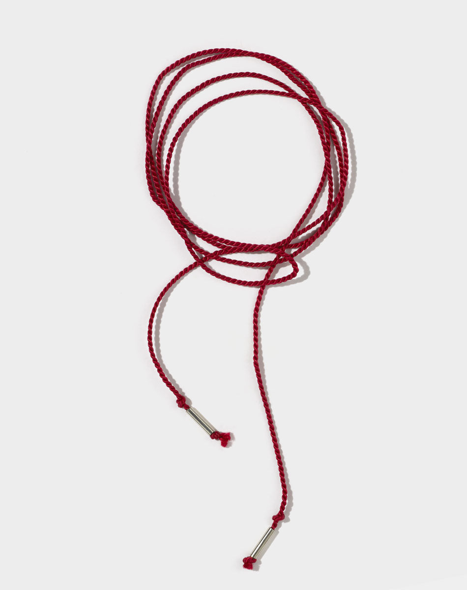 Red silk string cord necklace with silver ends. 