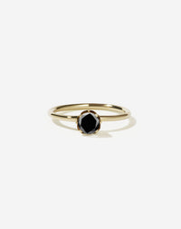 Meadowlark Jewellery’s classic Signature Solitaire Engagement Ring in 9ct Yellow Gold, with 0.46ct round brilliant cut black diamond. Set into our signature Meadowlark claw setting, featuring graphic lines inspired by our insignia. One of our most timeless and beloved Ceremonial designs, made to order in New Zealand. Pair with the diamond pave set Signature Eternity Wedding Band.