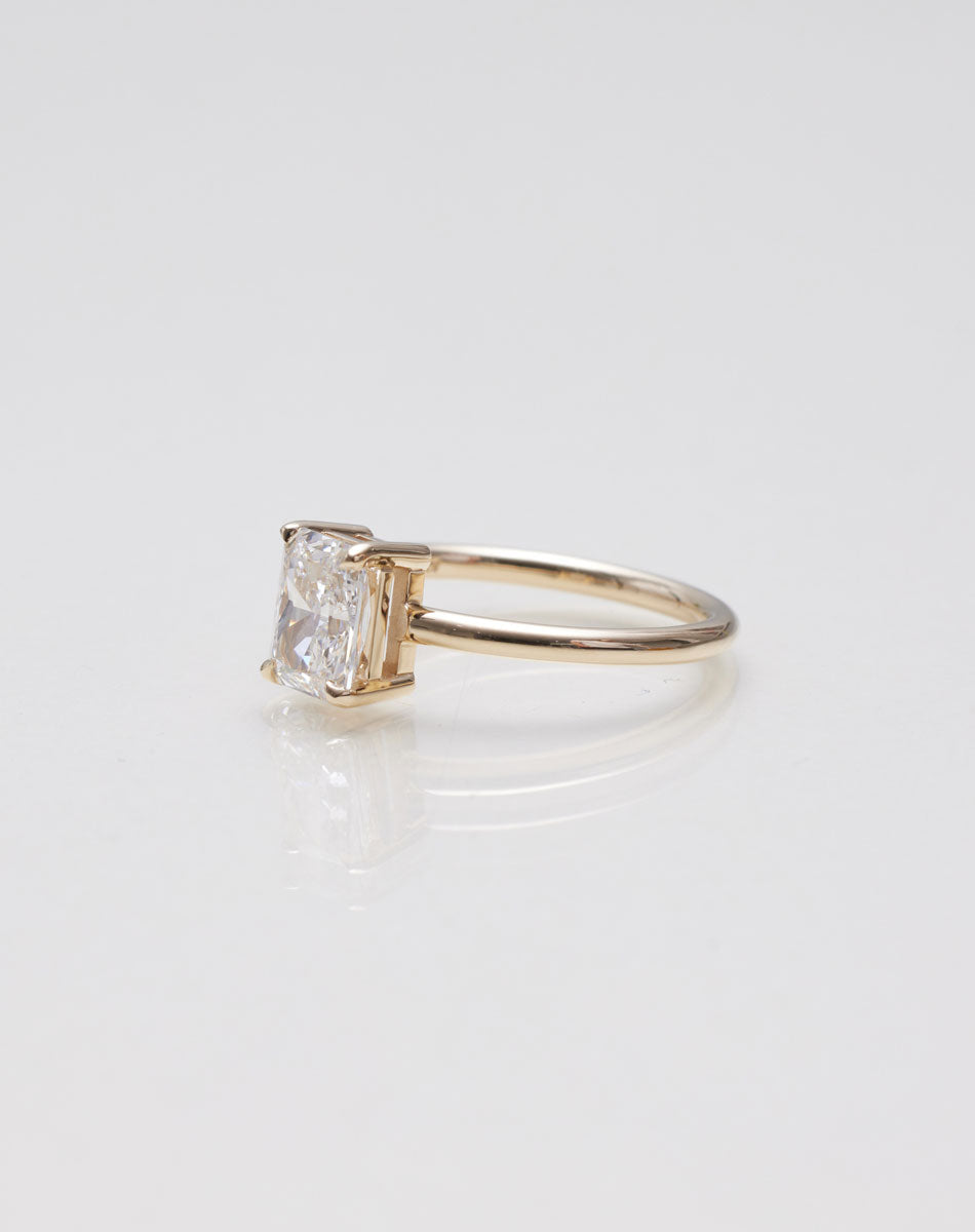 Radiant cut diamond Solitaire engagement ring side of ring