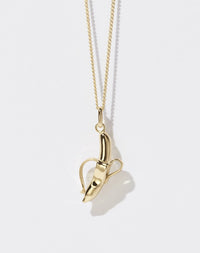 A 23k gold plated banana-shaped charm necklace on a fine gold chain.