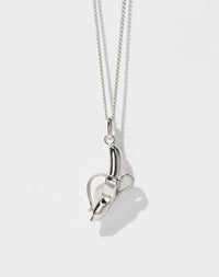 A sterling silver necklace featuring a charm in the shape of a banana