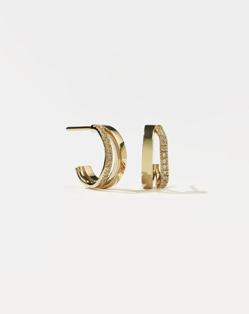 A pair of gold hoop earrings, pavé set with diamonds.