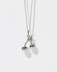 A sterling silver necklace featuring a cherry-shaped pendant on a fine chain.