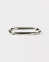 A minimalist round and endless sterling silver band designed to fit across two fingers.
