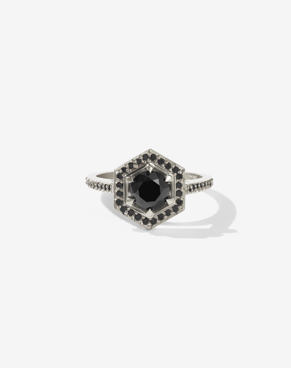Meadowlark Jewellery’s iconic Hex Engagement Ring 0.5ct in 14ct White Gold, claw set with 0.61ct round brilliant cut black diamond centre stone, surrounded by a hexagon halo of pave set black diamonds. One of our most beloved and modern Ceremonial designs, made to order in New Zealand. Pair with our bestseller, the Diamond Eternity Band.