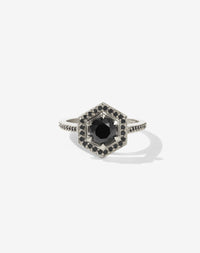 Meadowlark Jewellery’s iconic Hex Engagement Ring 0.5ct in 14ct White Gold, claw set with 0.61ct round brilliant cut black diamond centre stone, surrounded by a hexagon halo of pave set black diamonds. One of our most beloved and modern Ceremonial designs, made to order in New Zealand. Pair with our bestseller, the Diamond Eternity Band.