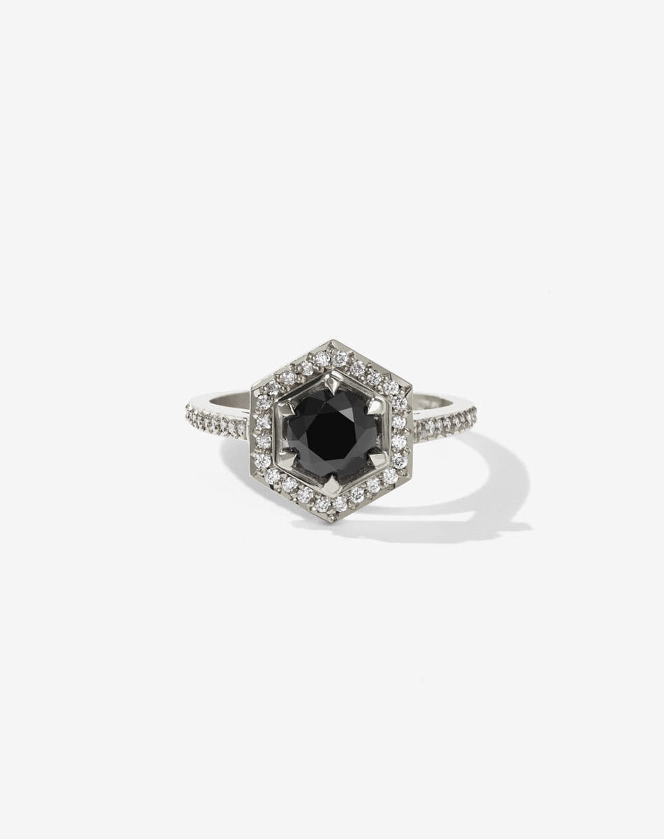 Meadowlark Jewellery’s iconic Hex Engagement Ring 0.5ct in 14ct White Gold, claw set with 0.61ct round brilliant cut black diamond centre stone, surrounded by a hexagon halo of pave set white diamonds. One of our most beloved and modern Ceremonial designs, made to order in New Zealand. Pair with our bestseller, the Diamond Eternity Band.