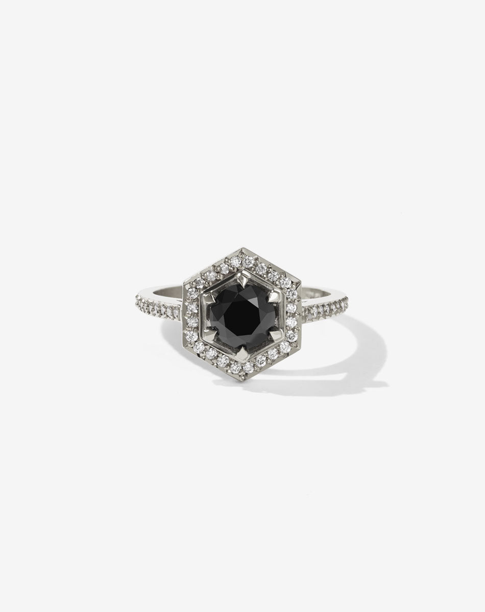 Meadowlark Jewellery’s iconic Hex Engagement Ring 0.5ct in 14ct White Gold, claw set with 0.61ct round brilliant cut black diamond centre stone, surrounded by a hexagon halo of pave set white diamonds. One of our most beloved and modern Ceremonial designs, made to order in New Zealand. Pair with our bestseller, the Diamond Eternity Band.