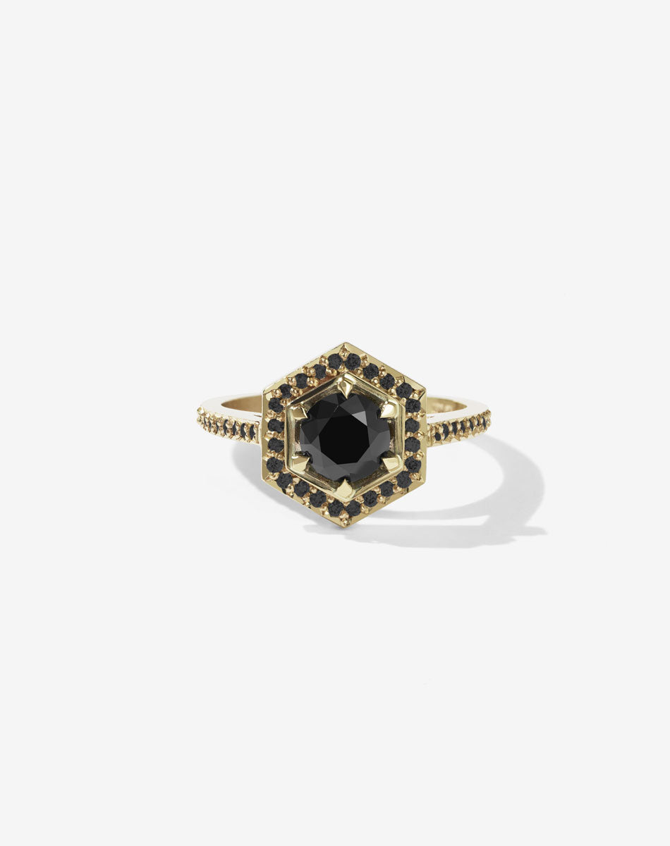  Meadowlark Jewellery’s iconic Hex Engagement Ring 0.5ct in 14ct Yellow Gold, claw set with 0.61ct round brilliant cut black diamond centre stone, surrounded by a hexagon halo of pave set black diamonds. One of our most beloved and modern Ceremonial designs, made to order in New Zealand. Pair with our bestseller, the Diamond Eternity Band.