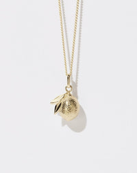 A 23k gold plated lemon-shaped charm necklace on a fine chain.