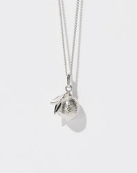 A sterling silver necklace with a lemon charm, suspended from a fine chain.