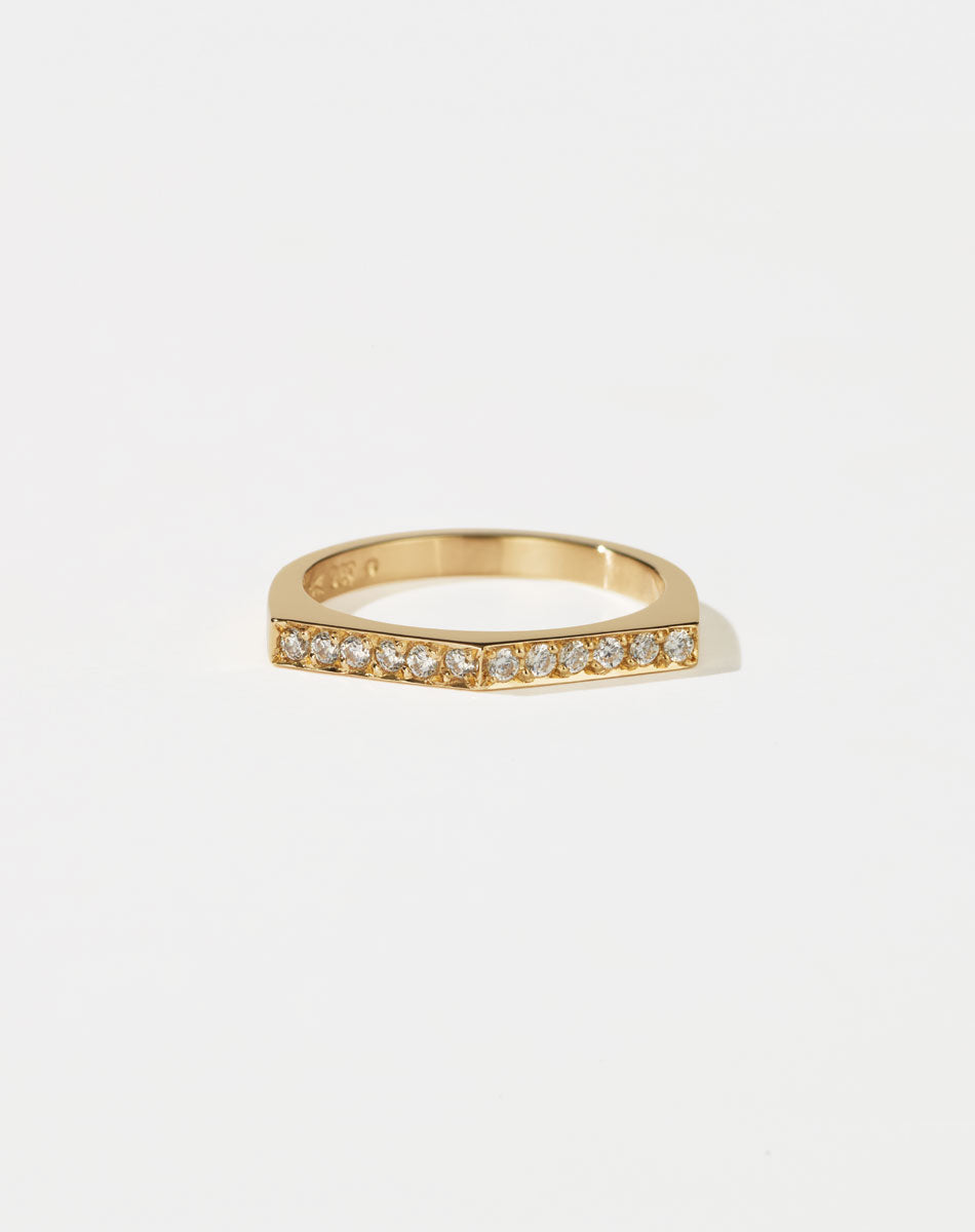 Meadowlark Jewellery’s architectural Geo Ring Arc in 9ct Yellow Gold, pave set with twelve round brilliant cut white diamonds atop a 1.5mm. A striking piece designed to be worn with the Geo Flat & Geo Point rings, or alone for a refined and minimal look. From the Dreams collection.