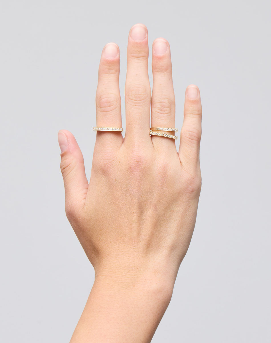 Meadowlark Jewellery’s architectural Geo Ring Flat in 9ct Yellow Gold, pave set with twelve round brilliant cut white diamonds atop a 1.5mm. A striking piece designed to be worn with the Geo Arc & Geo Point rings, or alone for a refined and minimal look. From the Dreams collection.