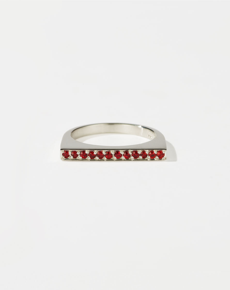 Meadowlark Jewellery’s architectural Geo Ring Flat in Sterling Silver, pave set with twelve round brilliant cut red sapphires atop a 1.5mm. A striking piece designed to be worn with the Geo Arc & Geo Point rings, or alone for a refined and minimal look. From the Dreams collection.