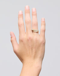 Meadowlark Jewellery’s architectural Geo Ring Arc in 9ct Yellow Gold, pave set with twelve round brilliant cut white diamonds atop a 1.5mm. A striking piece designed to be worn with the Geo Flat & Geo Point rings, or alone for a refined and minimal look. From the Dreams collection.