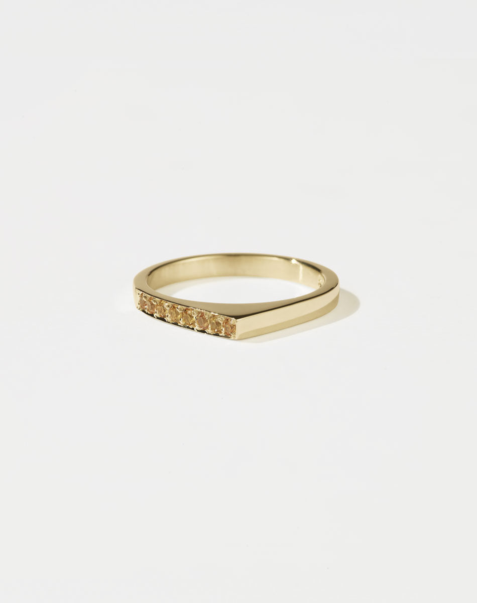 Meadowlark Jewellery’s architectural Geo Ring Point in 9ct Yellow Gold, pave set with twelve round brilliant cut yellow sapphires atop a 1.5mm. A striking piece designed to be worn with the Geo Flat & Geo Arc rings, or alone for a refined and minimal look. From the Dreams collection.