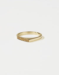 Meadowlark Jewellery’s architectural Geo Ring Point in 9ct Yellow Gold, pave set with twelve round brilliant cut yellow sapphires atop a 1.5mm. A striking piece designed to be worn with the Geo Flat & Geo Arc rings, or alone for a refined and minimal look. From the Dreams collection.