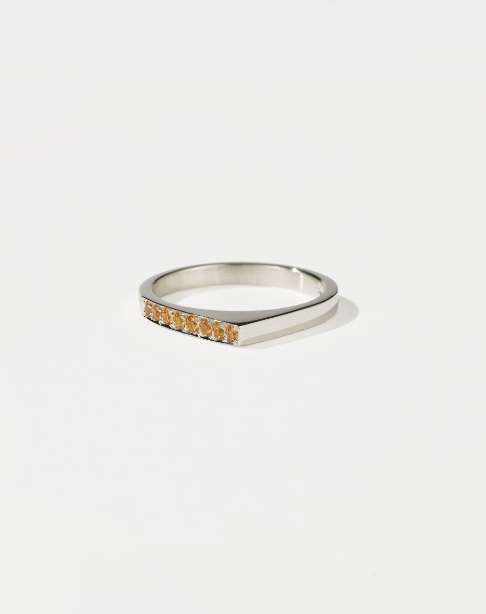 Meadowlark Jewellery’s architectural Geo Ring Point in Sterling Silver, pave set with twelve round brilliant cut yellow sapphires atop a 1.5mm. A striking piece designed to be worn with the Geo Flat & Geo Arc rings, or alone for a refined and minimal look. From the Dreams collection.