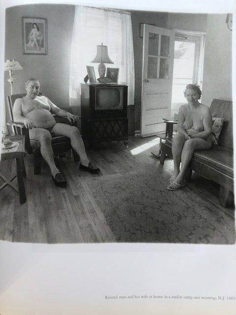 Retired man and his wife at home in a nudist camp one morning, New Jersey.
Photograph by Diane Arbus.