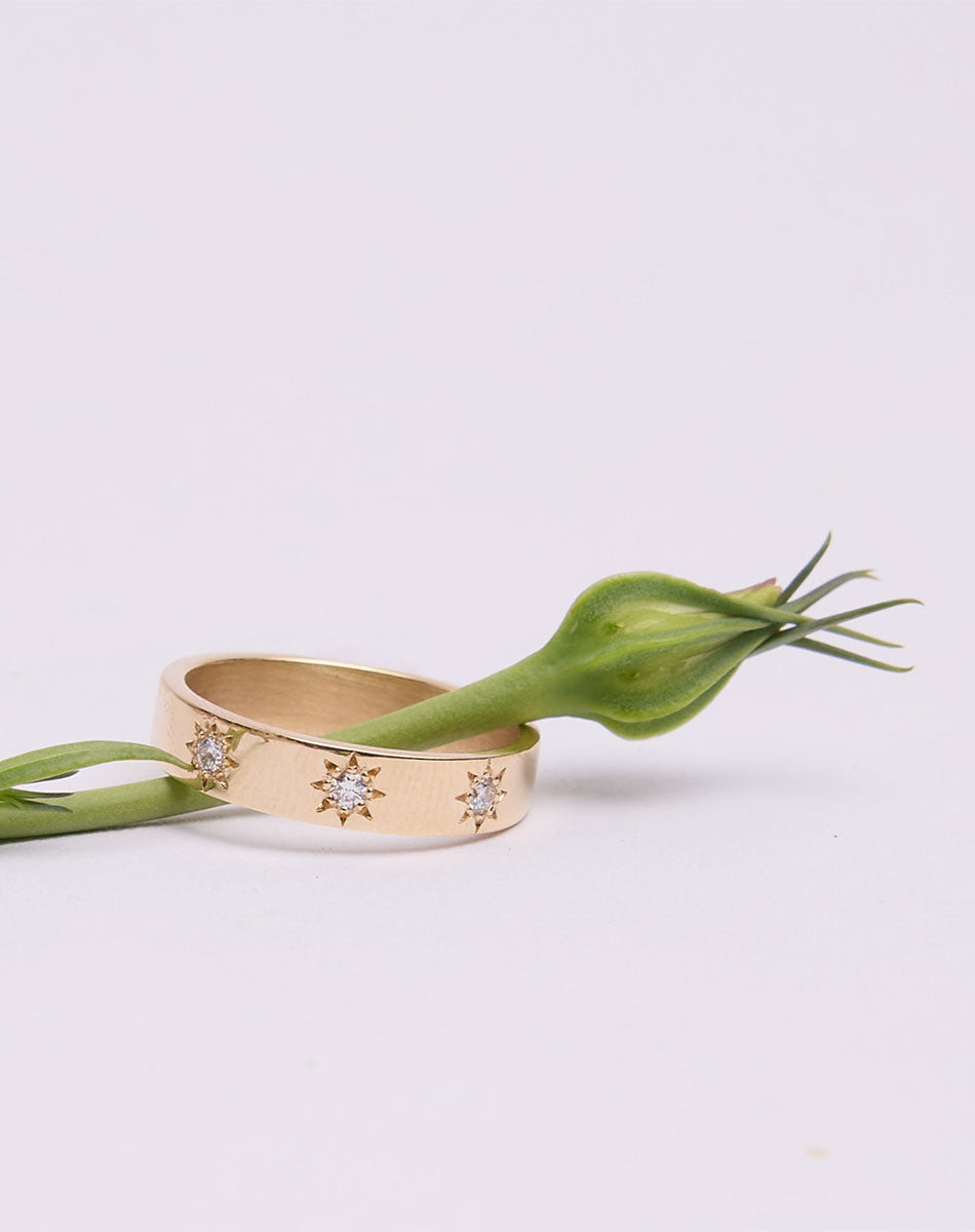Lulu 3 Star Band in 9ct Yellow Gold with star set round brilliant cut White Diamond. 4.5mm width wedding band.