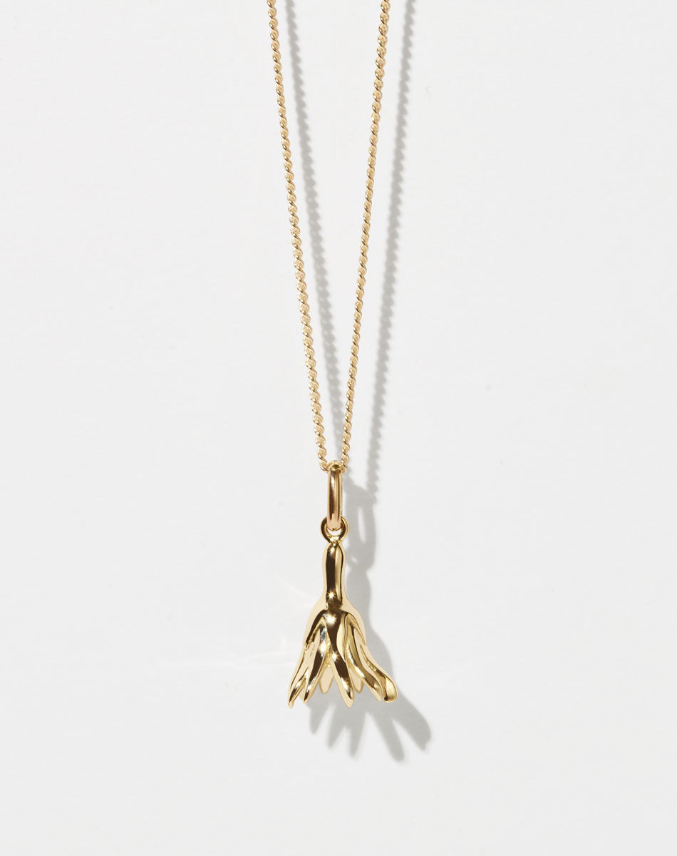 Meadowlark Jewellery’s Magda Charm Necklace in  23k Gold Plated Sterling Silver or 9ct Yellow Gold. A single bell-shaped flower charm suspended from a fine diamond curb chain. A symbol of quiet transformation and the tender strength of nature. From the Dreams collection.
