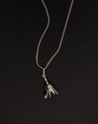 Meadowlark Jewellery’s Magda Charm Necklace in Sterling Silver. A single bell-shaped flower charm suspended from a fine diamond curb chain. A symbol of quiet transformation and the tender strength of nature. From the Dreams collection.