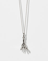 Meadowlark Jewellery’s Magda Charm Necklace in Sterling Silver. A single bell-shaped flower charm suspended from a fine diamond curb chain. A symbol of quiet transformation and the tender strength of nature. From the Dreams collection.