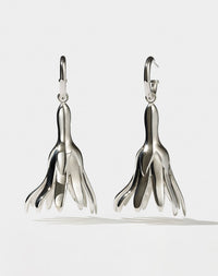 Meadowlark Jewellery’s sculptural Magda Drop Earrings Large in Sterling Silver. Bell-shaped flowers suspended from our classic Aria Hoop Earrings. A bold, deliberately off-beat statement. From the Dreams collection.