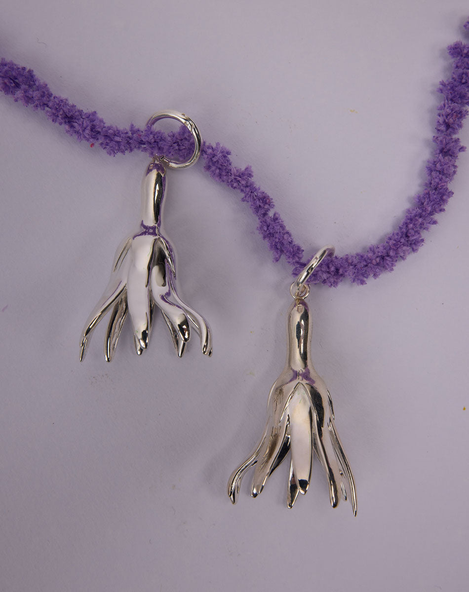 Meadowlark Jewellery’s sculptural Magda Drop Earrings Large in Sterling Silver. Bell-shaped flowers suspended from our classic Aria Hoop Earrings. A bold, deliberately off-beat statement. From the Dreams collection.