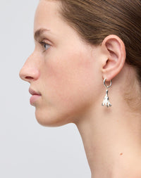 Meadowlark Jewellery’s sculptural Magda Drop Earrings Medium in Sterling Silver. Bell-shaped flowers suspended from our classic Aria Hoop Earrings. An expressive yet effortlessly wearable piece. From the Dreams collection.