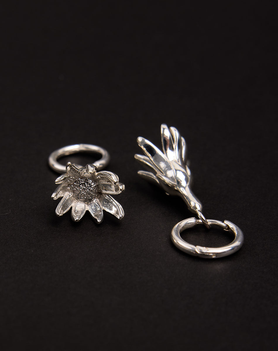 Meadowlark Jewellery’s sculptural Magda Drop Earrings Medium in Sterling Silver. Bell-shaped flowers suspended from our classic Aria Hoop Earrings. An expressive yet effortlessly wearable piece. From the Dreams collection.