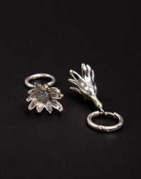 Meadowlark Jewellery’s sculptural Magda Drop Earrings Medium in Sterling Silver. Bell-shaped flowers suspended from our classic Aria Hoop Earrings. An expressive yet effortlessly wearable piece. From the Dreams collection.