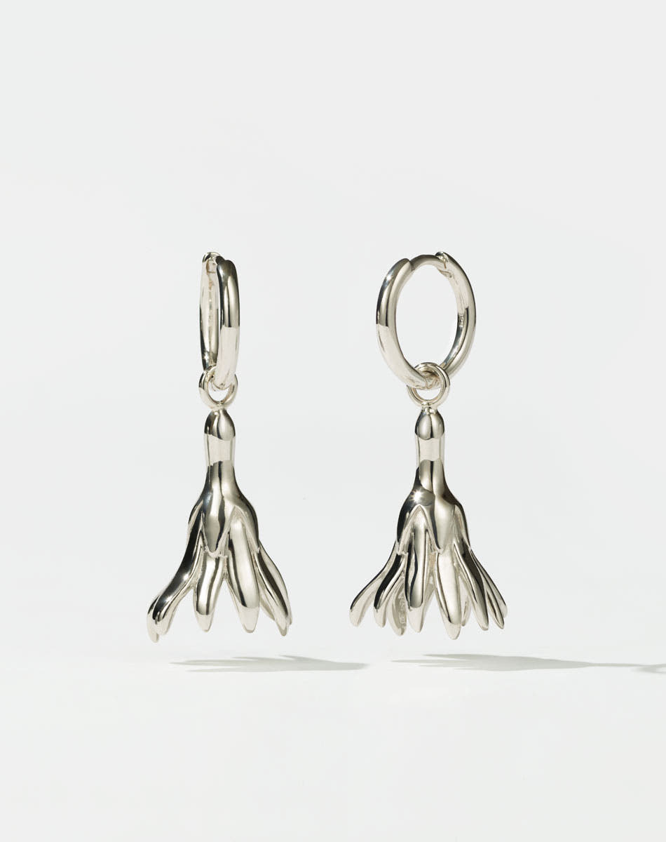 Meadowlark Jewellery’s sculptural Magda Drop Earrings Medium in Sterling Silver. Bell-shaped flowers suspended from our classic Aria Hoop Earrings. An expressive yet effortlessly wearable piece. From the Dreams collection.