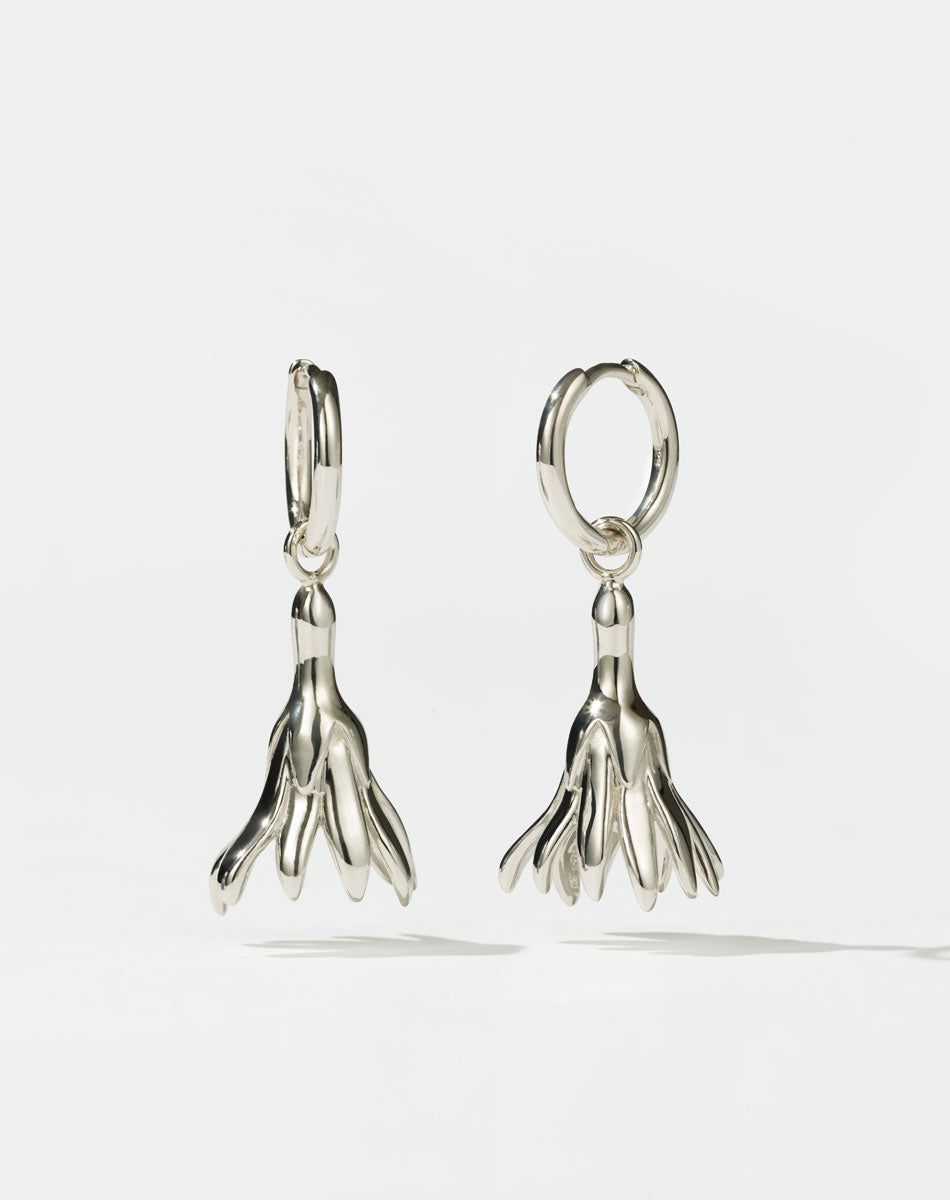 Meadowlark Jewellery’s sculptural Magda Drop Earrings Medium in Sterling Silver. Bell-shaped flowers suspended from our classic Aria Hoop Earrings. An expressive yet effortlessly wearable piece. From the Dreams collection.