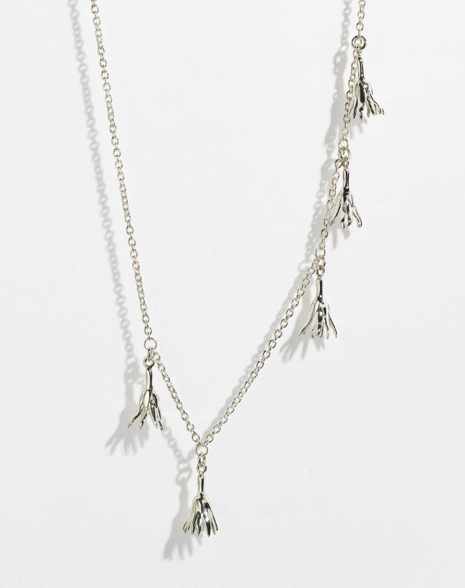 Silver necklace with tassel pendants in the shape of flowers