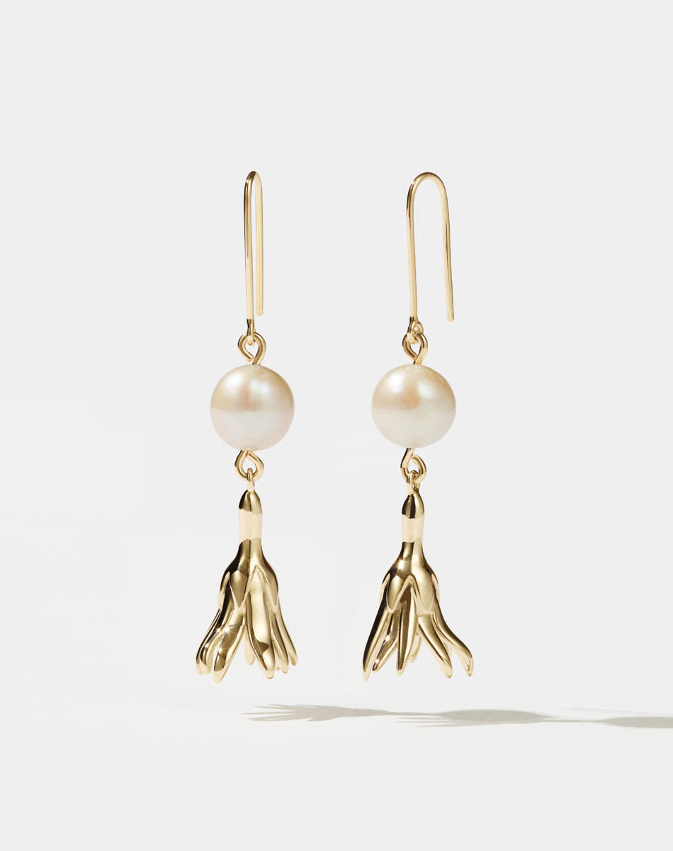 Meadowlark Jewellery’s refined Magda Pearl Earrings in 23k Gold Plated Sterling Silver or 9ct Yellow Gold. An ethereal, bell-shaped flower charm suspended from a lustrous round, freshwater pearl – bringing an air of quiet luxury to any ensemble. Light-catching and dreamlike. From the Dreams collection.