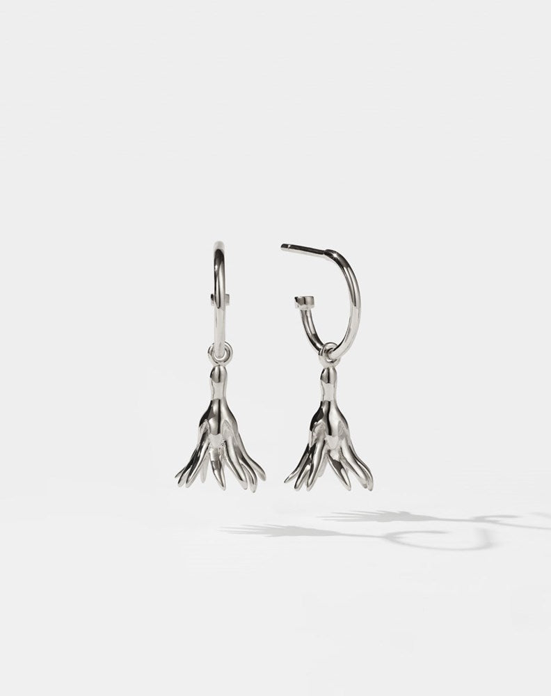 Meadowlark Jewellery’s timeless, everyday Magda Signature Hoop Earrings in Sterling Silver. An enchanting, bell-shaped flower charm suspended from classic signature hoops. From the Dreams collection.