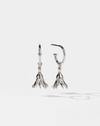Meadowlark Jewellery’s timeless, everyday Magda Signature Hoop Earrings in Sterling Silver. An enchanting, bell-shaped flower charm suspended from classic signature hoops. From the Dreams collection.