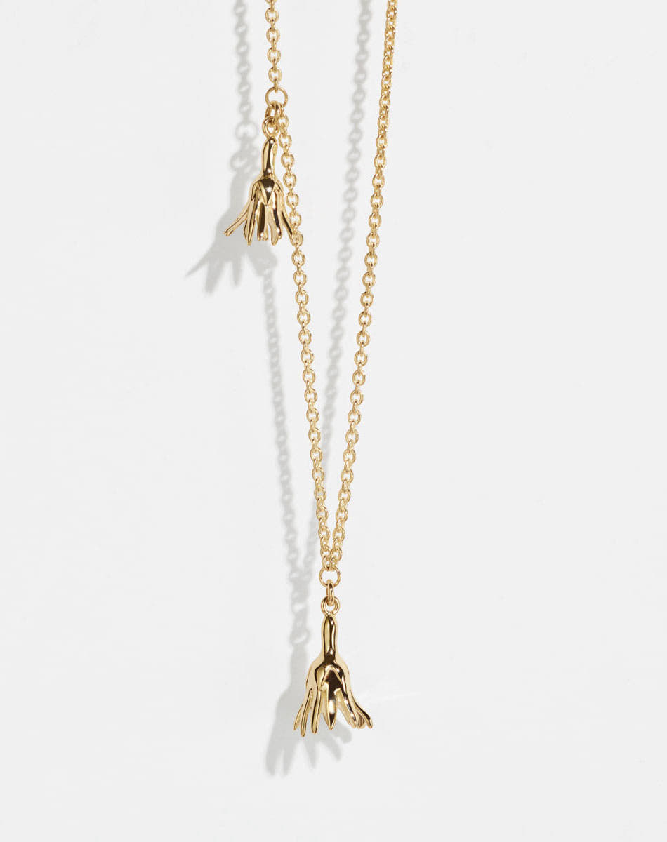 Meadowlark Jewellery’s Magda Two Charm Necklace in 23k Gold Plated Sterling Silver or 9ct Yellow Gold. Two delicate, bell-shaped flower charms suspended from a fine diamond curb chain. A minimalist ode to blooming and the enduring cycles of life. From the Dreams collection.