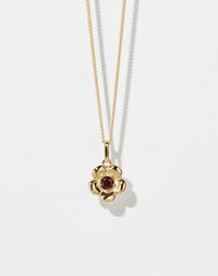 Meadowlark Jewellery’s floral Posie Charm Necklace in 23k Gold Plated Sterling Silver or 9ct Yellow Gold, set with a single round brilliant cut African Garnet stone. Hung from a fine diamond curb chain. Inspired by classic floral motifs and our beloved Alba designs, a timeless symbol of grace, growth and renewal. Celebrating life’s continual renewal. From the Dreams collection.