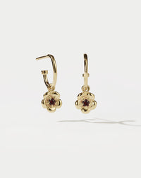 Meadowlark Jewellery’s floral Posie Signature Hoop Earrings in 23k Gold Plated Sterling Silver or 9ct Yellow Gold, set with a single round brilliant cut African Garnet stone. Hung from classic signature hoop earrings. Inspired by classic floral motifs and our beloved Alba designs, a timeless symbol of grace, growth and renewal. Celebrating life’s continual renewal. From the Dreams collection.