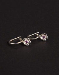 Meadowlark Jewellery’s floral Posie Signature Hoop Earrings in  Sterling Silver, set with a single round brilliant cut Pink Sapphire stone. Hung from classic signature hoop earrings. Inspired by classic floral motifs and our beloved Alba designs, a timeless symbol of grace, growth and renewal. Celebrating life’s continual renewal. From the Dreams collection.