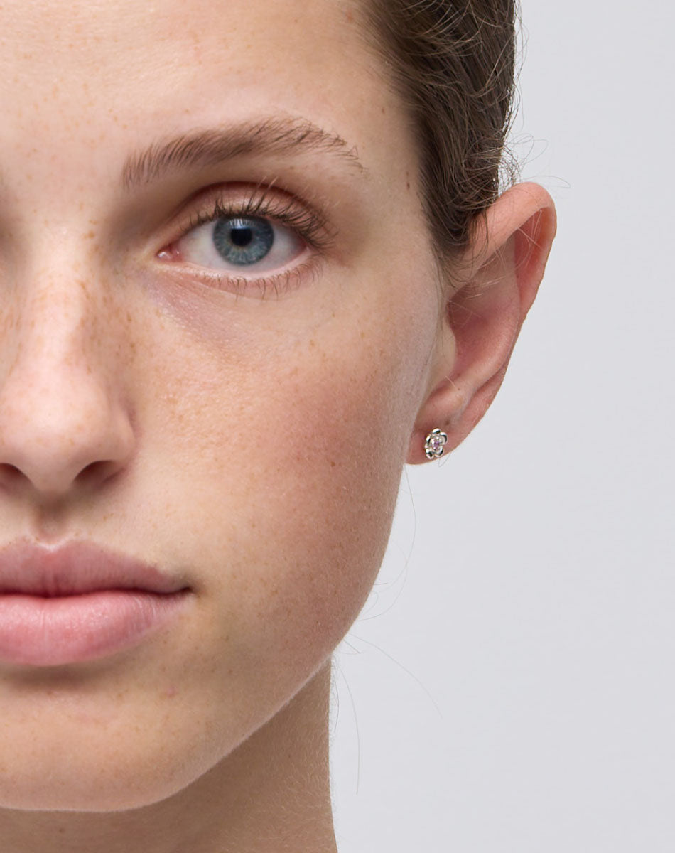 Meadowlark Jewellery’s floral Posie Stud Earrings in Sterling Silver, set with a single round brilliant cut Pink Sapphire stone. Inspired by classic floral motifs and our beloved Alba designs, a timeless symbol of grace, growth and renewal. Celebrating life’s continual renewal. From the Dreams collection.