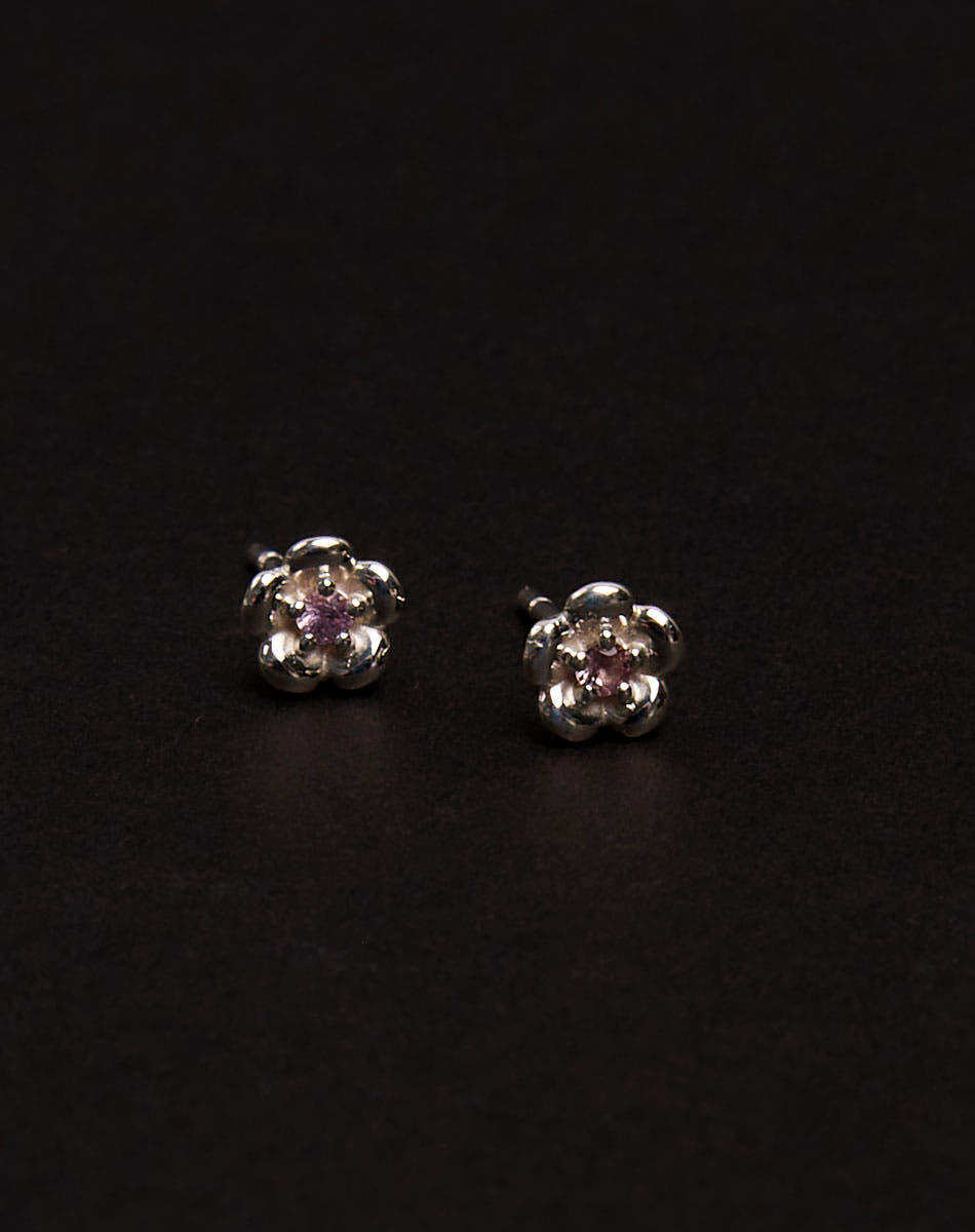 Meadowlark Jewellery’s floral Posie Stud Earrings in Sterling Silver, set with a single round brilliant cut Pink Sapphire stone. Inspired by classic floral motifs and our beloved Alba designs, a timeless symbol of grace, growth and renewal. Celebrating life’s continual renewal. From the Dreams collection.