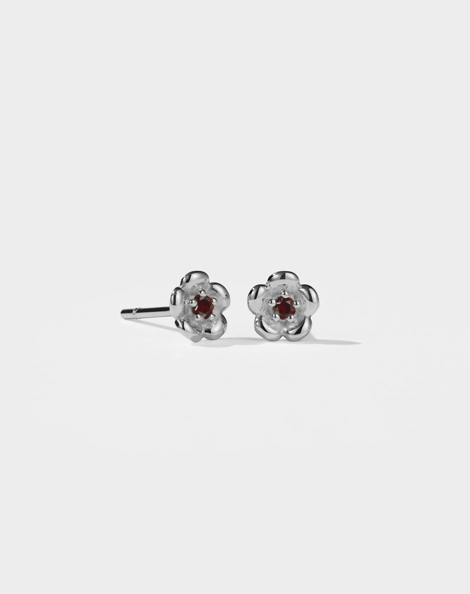 Meadowlark Jewellery’s floral Posie Stud Earrings in Sterling Silver, set with a single round brilliant cut African Garnet stone. Inspired by classic floral motifs and our beloved Alba designs, a timeless symbol of grace, growth and renewal. Celebrating life’s continual renewal. From the Dreams collection.