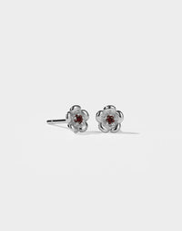 Meadowlark Jewellery’s floral Posie Stud Earrings in Sterling Silver, set with a single round brilliant cut African Garnet stone. Inspired by classic floral motifs and our beloved Alba designs, a timeless symbol of grace, growth and renewal. Celebrating life’s continual renewal. From the Dreams collection.