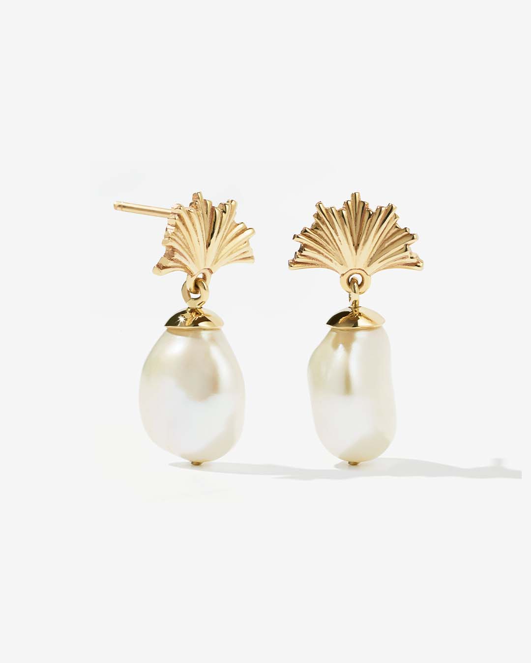 Natasha wears the Vita Drop Earrings Small.